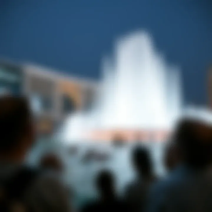 Enthralled spectators witnessing the Dubai Mall Fountain Show Crowd gathered to enjoy the enchanting fountain display at night